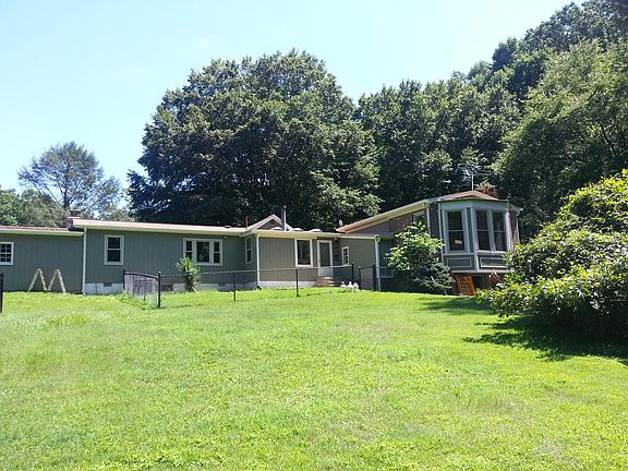 Rear yard with small fenced area, larger fenced area to righ