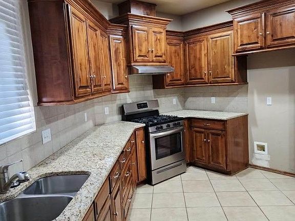 The kitchen has tons of cabinet space. There is no picture of the cabinets on the breakfast bar.