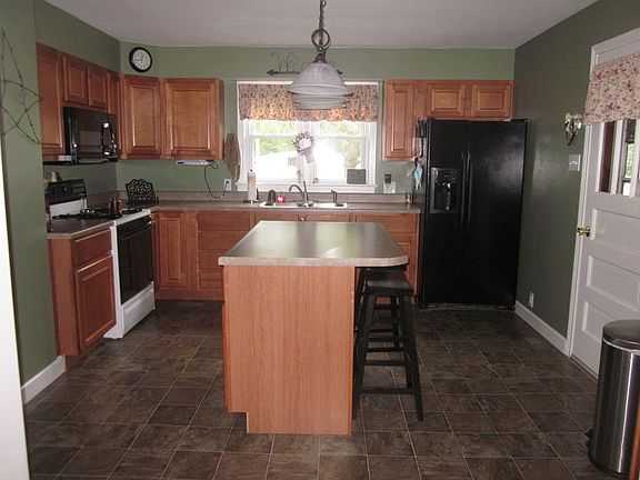 Kitchen
						:
						Custom cabinetry in corner of kitchen. Large breezeway connects house to garage.