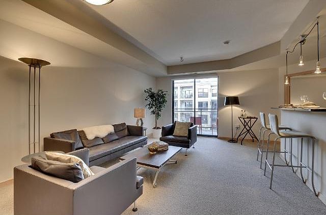Spacious living room with door to deck.