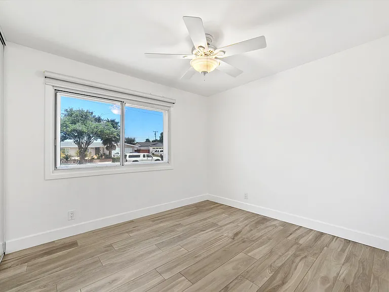 Front bedroom with oversized mirrored closet