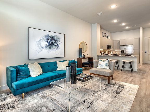 Large living areas with wood-like plank flooring
