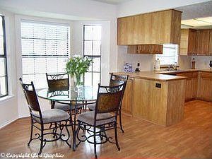 Nice dining area with bar and bay window
