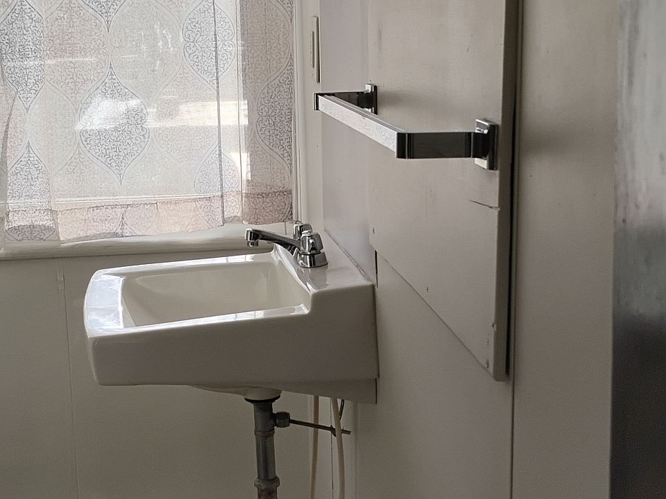 bathroom showing sink. toilet is across from sink