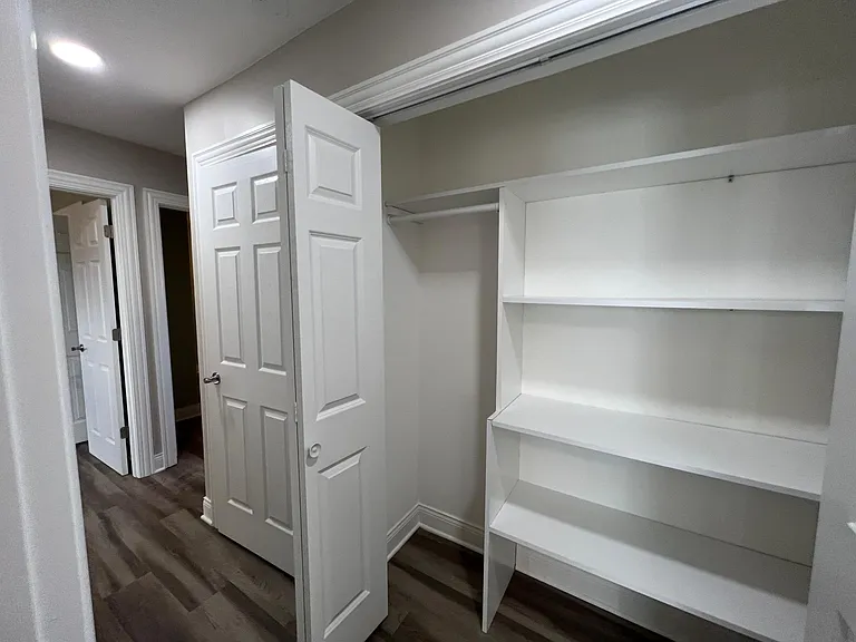 Custom closet shelving in hallway