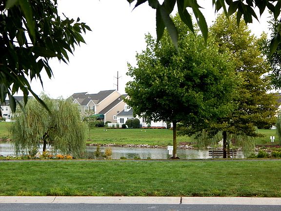 Back of home fr. across pond