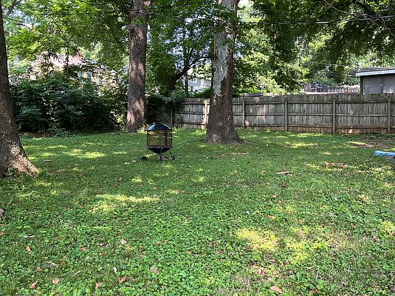 Spacious fenced back yard perfect for BBQ or play