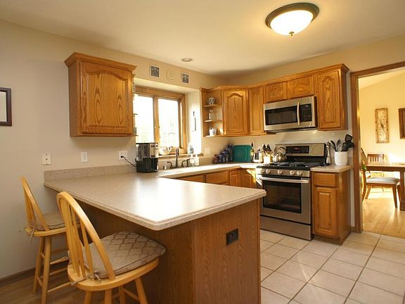 Kitchen With Snack Bar and Ceramic Tile