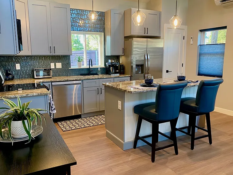 Full Kitchen with ALL NEW appliances, including full-size OVEN for those that like to cook! Full-size DISHWASHER, FRIDGE, pantry as well as lots of cabinet space.