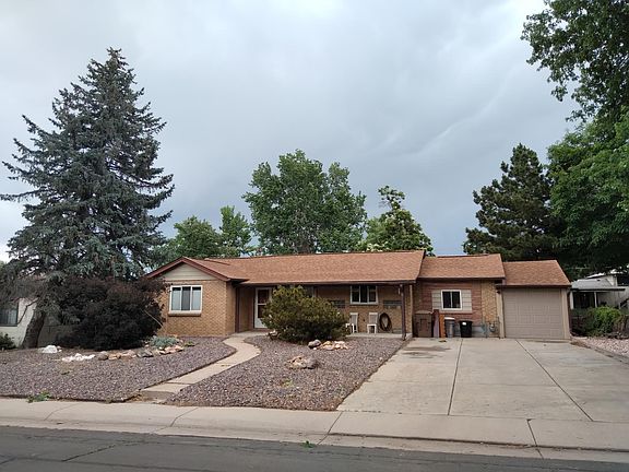 Home from Marshall Street. Xeriscaped front yard for low maintenance & very large driveway for plenty of parking in addition to the garage.