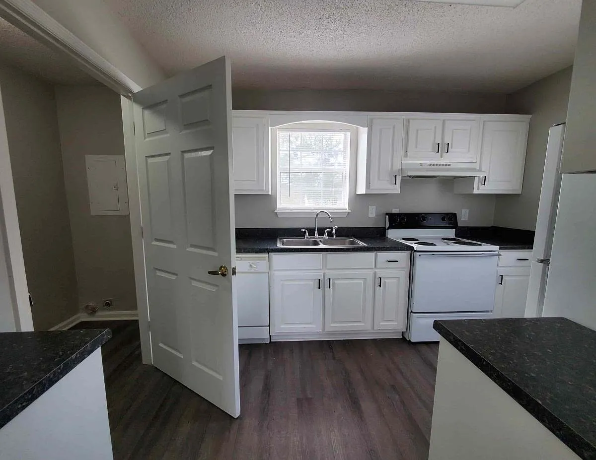 Laundry room off the kitchen. - Holly Cove Apartments