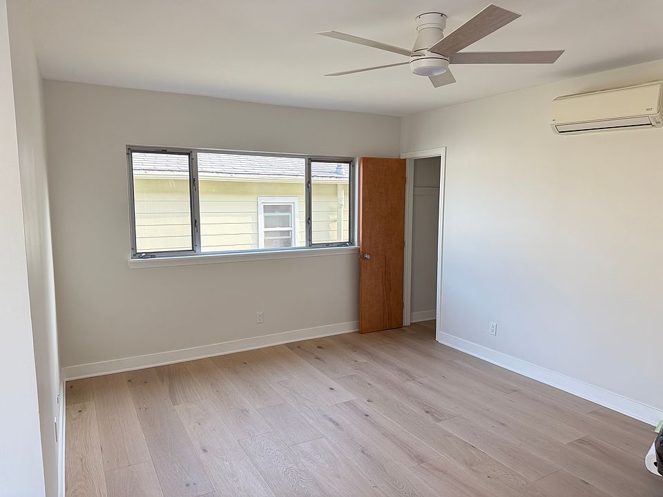 Living room with closet. All rooms have ceiling fans