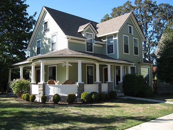 Front of house showing large porch.