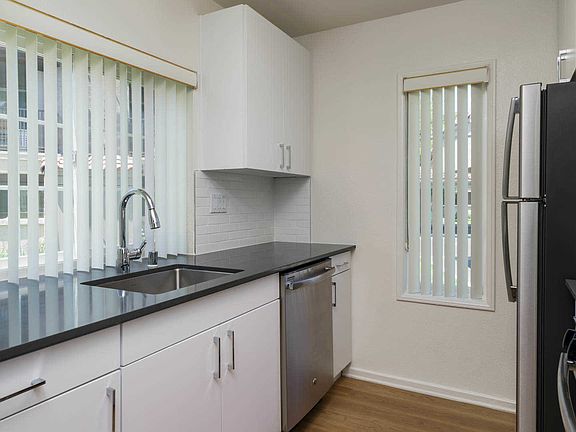 Kitchen with Stainless Steel Appliances and Quartz Countertops