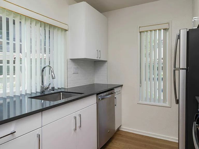 Kitchen with Stainless Steel Appliances and Quartz Countertops