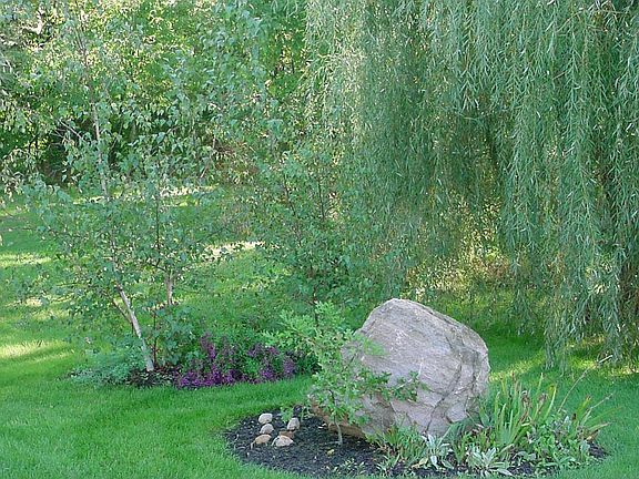Weeping willows and ornamental grasses add color and variety