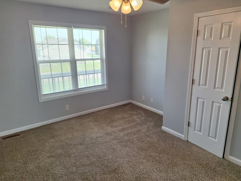 Master bedroom with ceiling fan.