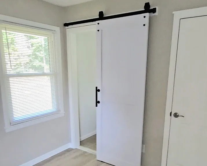 Barn door to primary bath