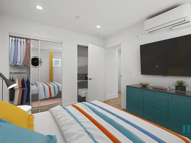 Bedroom with Mirrored Closet, Recessed Lighting, and Vinyl Flooring