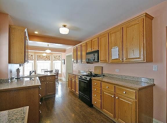 Updated kitchen opens to eating area and family room
