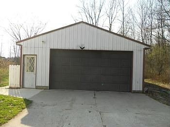 Pole building is 4 car (tandem), insulated and heated with a workshop.