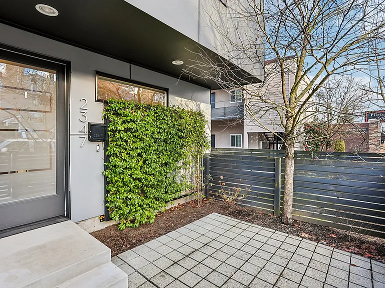 Fenced in courtyard at front entrance.