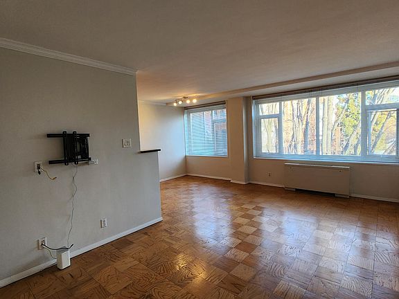 Spacious living room for relaxing and dining area for hosting.