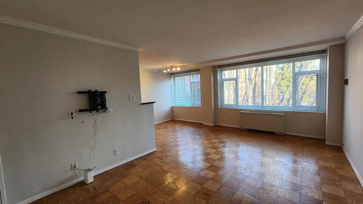 Spacious living room for relaxing and dining area for hosting. - 1545 18th St NW #311