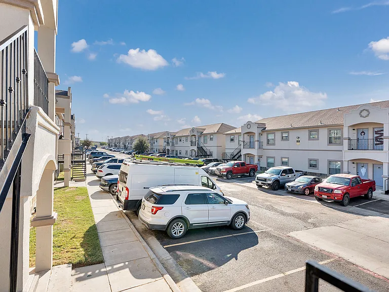 Elegant balcony perspective of Merida Vista Apartments, featuring the sophisticated exterior and tranquil environment in Laredo, Texas