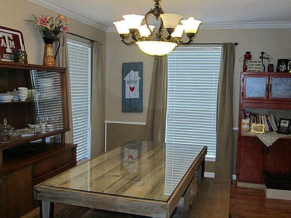 Formal dining is spacious! Chair rail and decorative paint make for a designer statement.