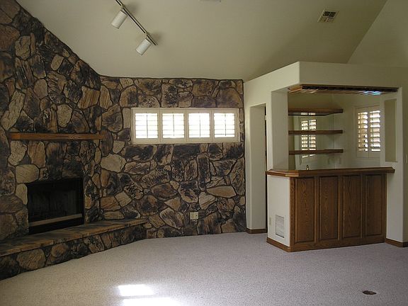 Open Family Room w/Wet Bar and Stone Fireplace