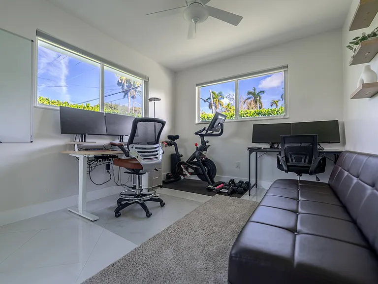 Bedroom 3 - Option to setup as office with desks, monitors, peloton, dumbells and futon