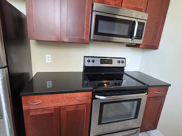 Kitchen with range and microwave