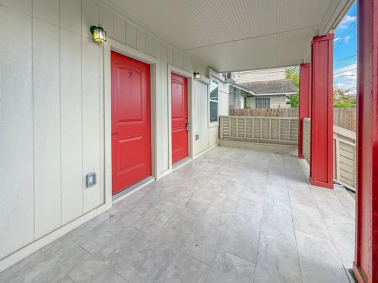 Discover the charm of this inviting shared front porch, perfect for enjoying a sense of community with neighbors from units 1 and 2.
