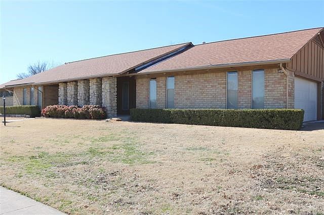 Attractive full brick ranch on a large corner lot with side entry garage.