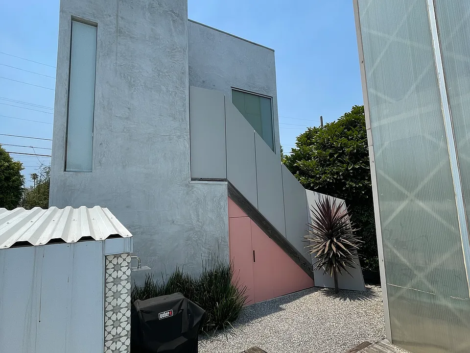 Looking from the front house to the lower level garden studio. Private and Safe.