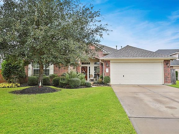 Well landscaped with to mature trees and beds with annual color. Double wide driveway to a garage door opener that has been replaced recently. Newer outside light fixtures.