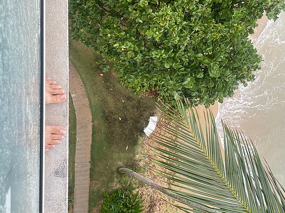 View from the lanai straight down to the beach - those are my toes - that is how close to the beach you are