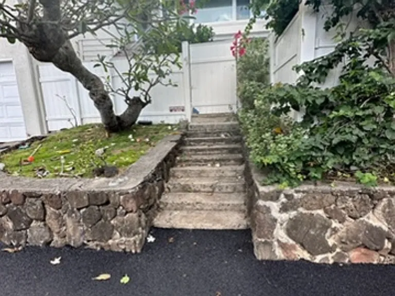 Entrance. Newly paved driveway.