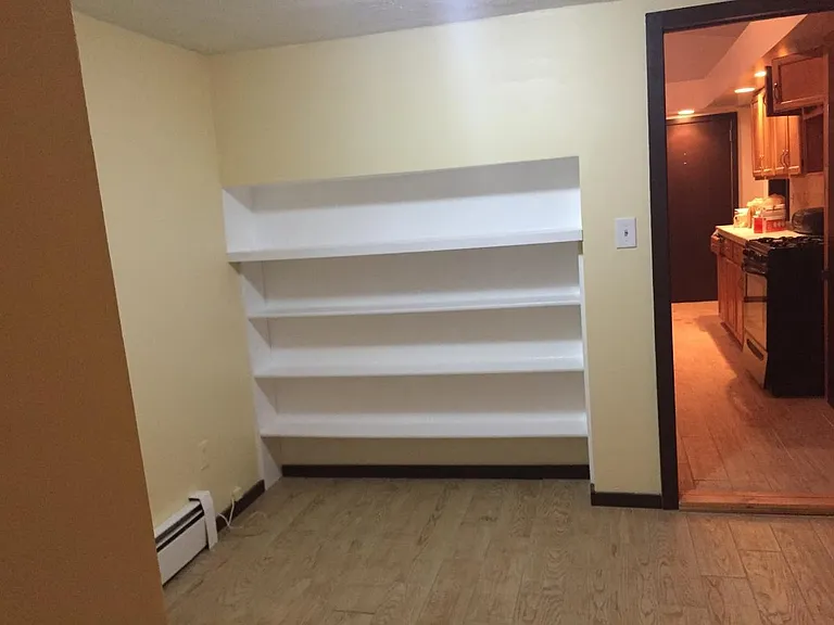 Built in shelving in larger bedroom
