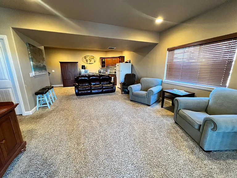 Comfortable sitting area w/large wall mounted Smart-TV. Ping-Pong Table access, walk-out basement, Dining table