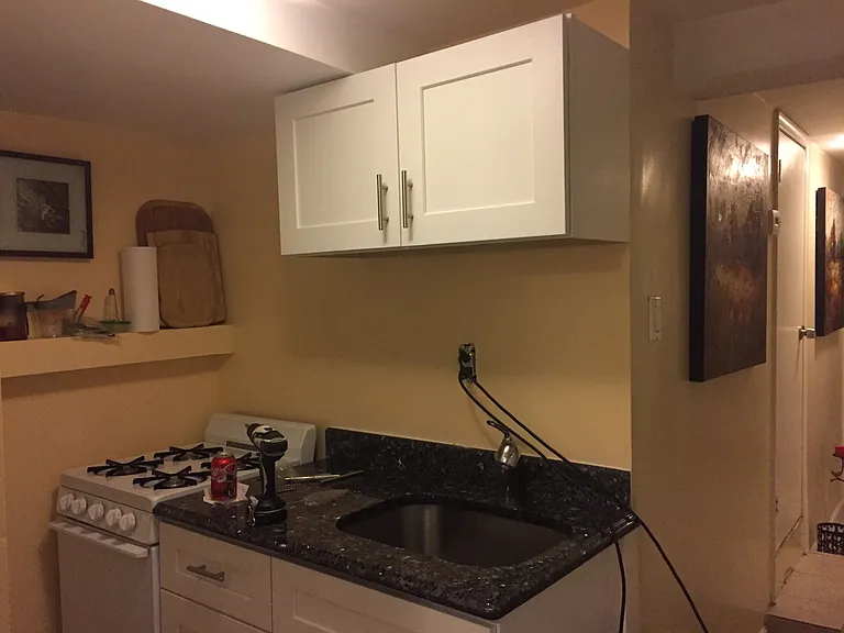 kitchen, with stove and granite countertop