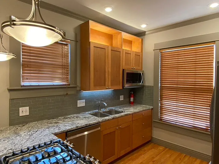 Kitchen Showing Upper Cabinet w/ Integrated Lighting