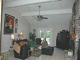 Huge den with high vaulted ceiling, recessed lighting, french patio doors, bri