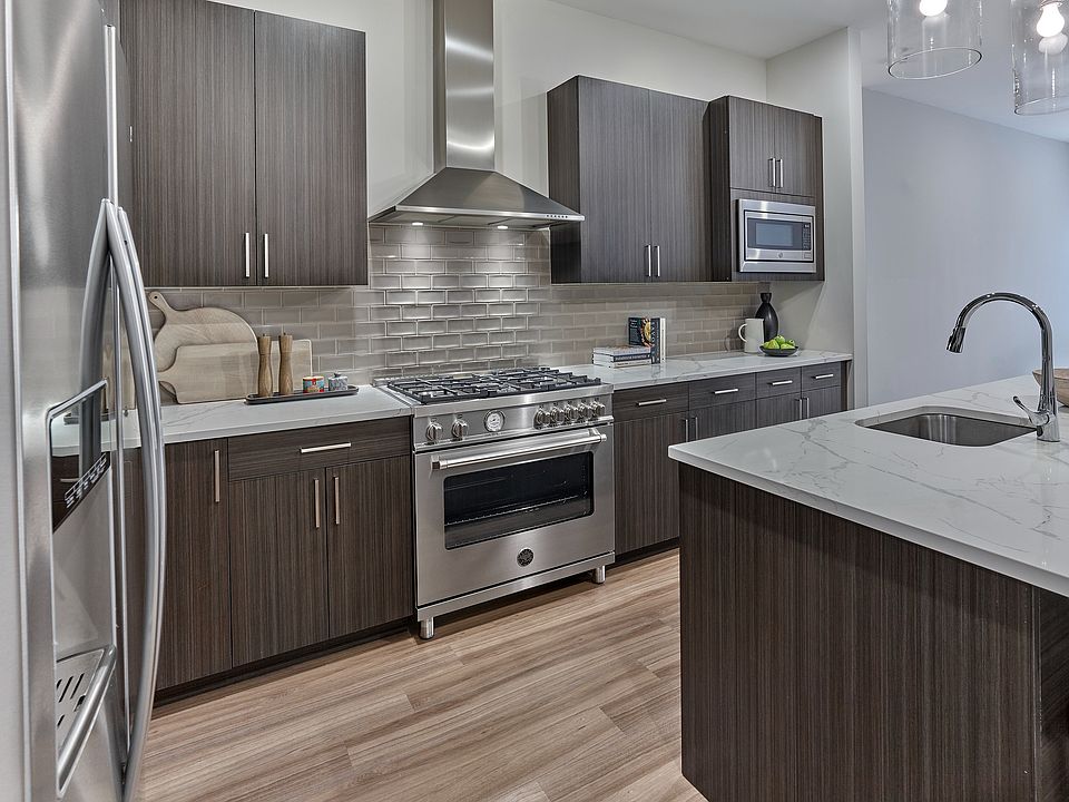 Experience elegance in this penthouse with upgraded kitchen appliances, including 36" Bertazzoni range, designed for style and functionality.