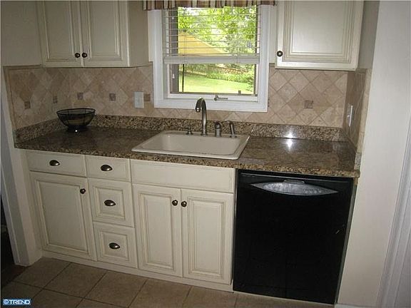 Renovated kitchen with granite counters