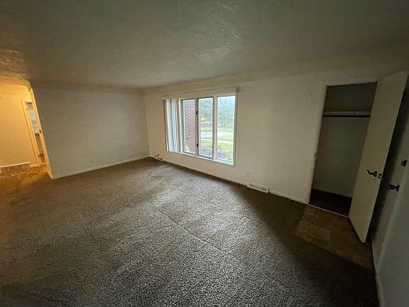 Living room and front closet.