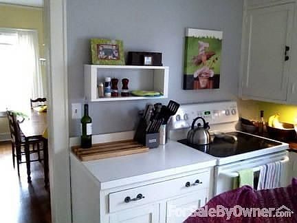 Partial kitchen view
						:
						Also shows view of dining room in the background