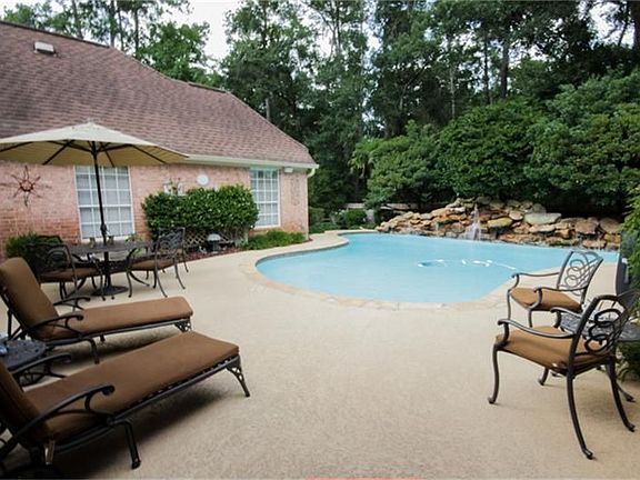 Heated pool with rock waterfall.