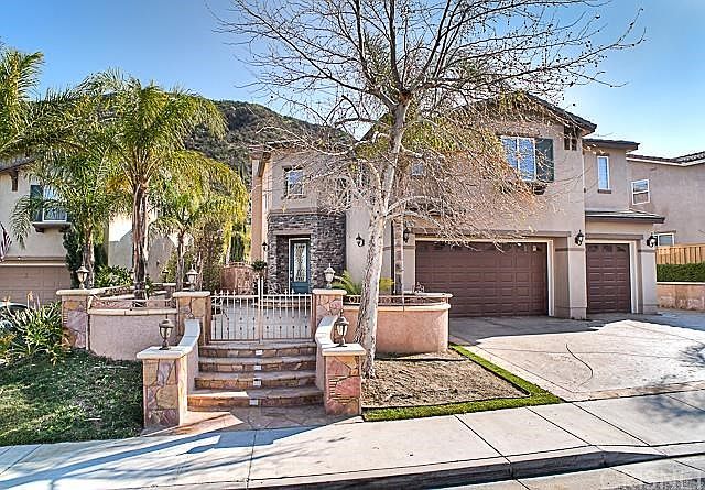 Custom built hardscape and gorgeous stamped concrete and custom built planters throughout.